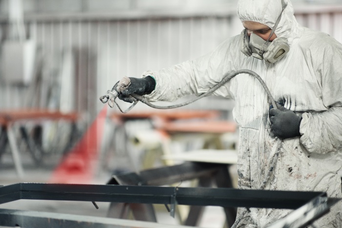 A team member from Eco-Clean Inc. is providing powder coating services in Atlanta, GA