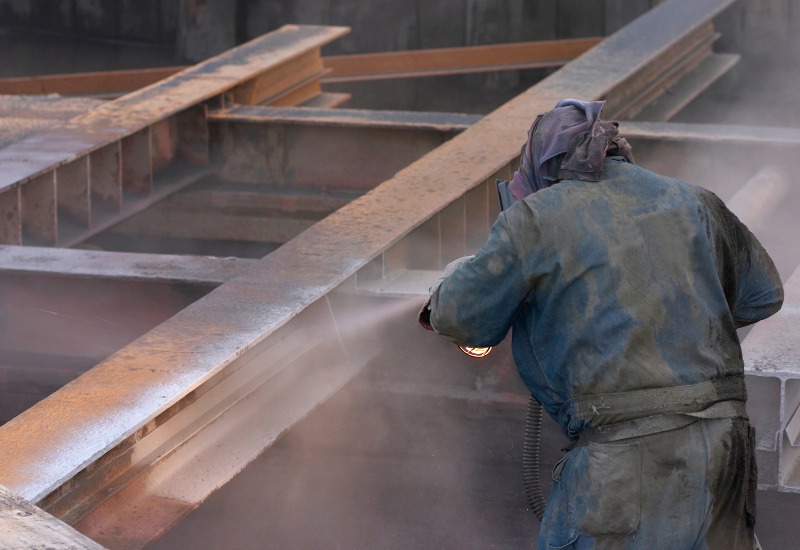 A team member from Eco-Clean Inc. is offering media blasting services in Atlanta, GA
