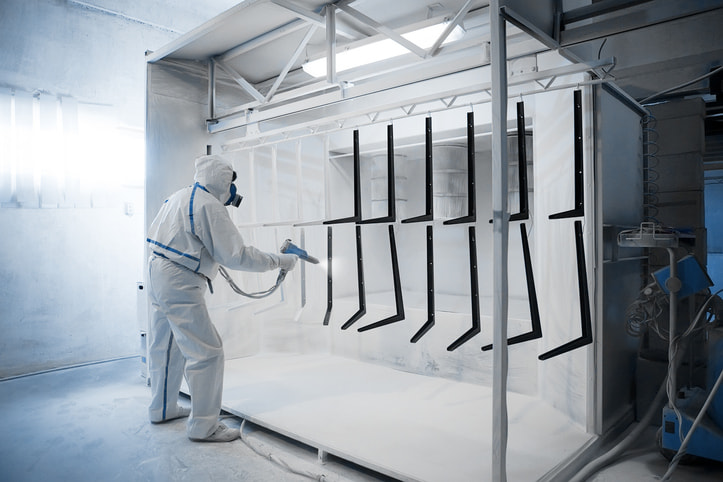Powder coating process for metal parts in an industrial spray booth in Atlanta, GA